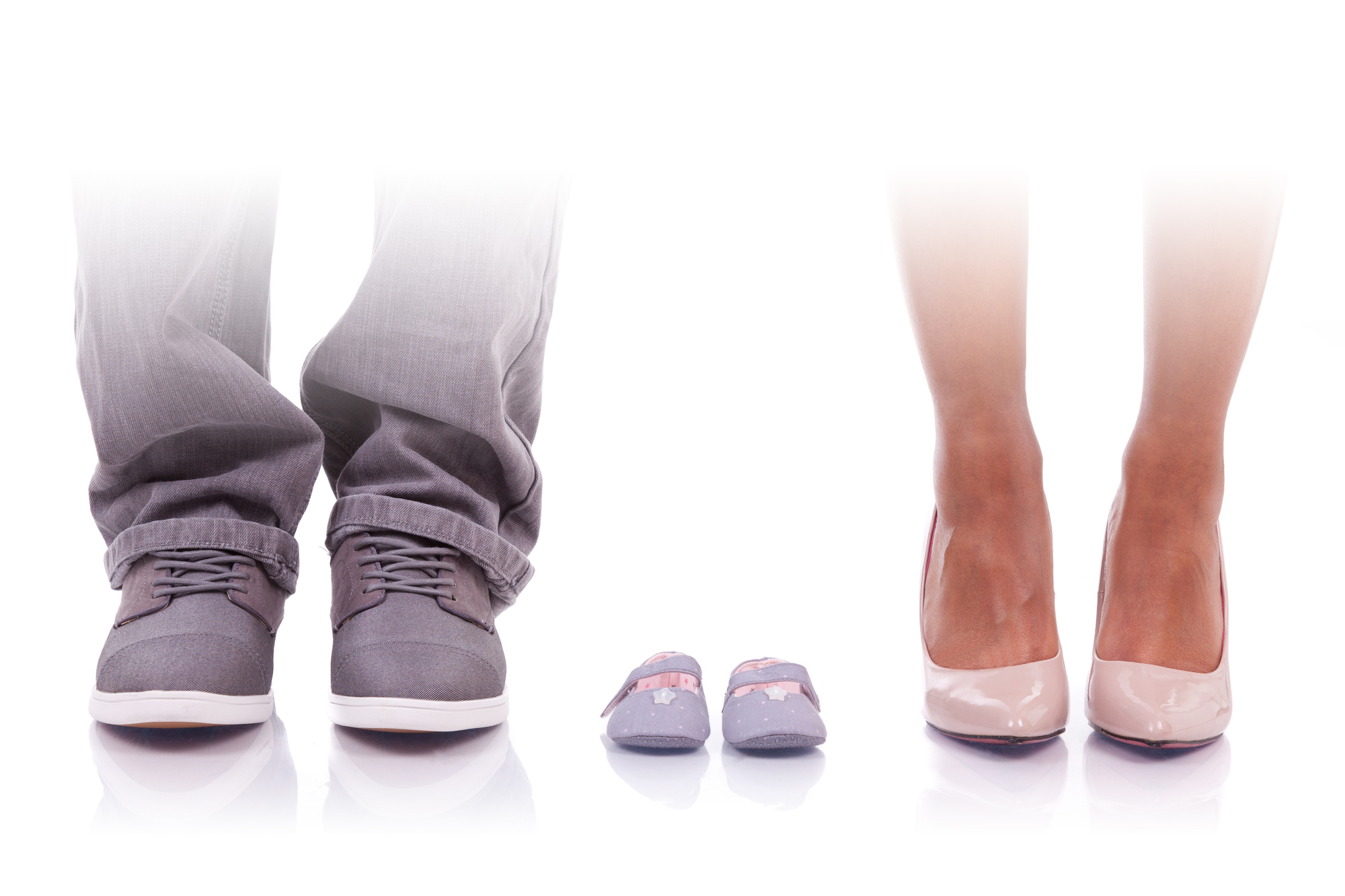 Image of parents with baby shoes